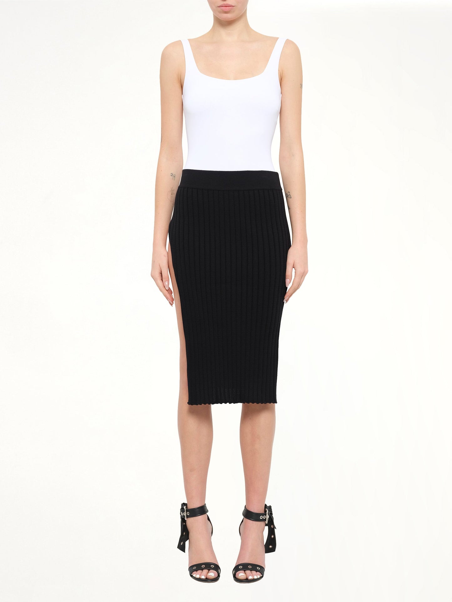 Image of a model wearing Skirts. Product name - Givenchy Skirt in Black colour by brand - GIVENCHY