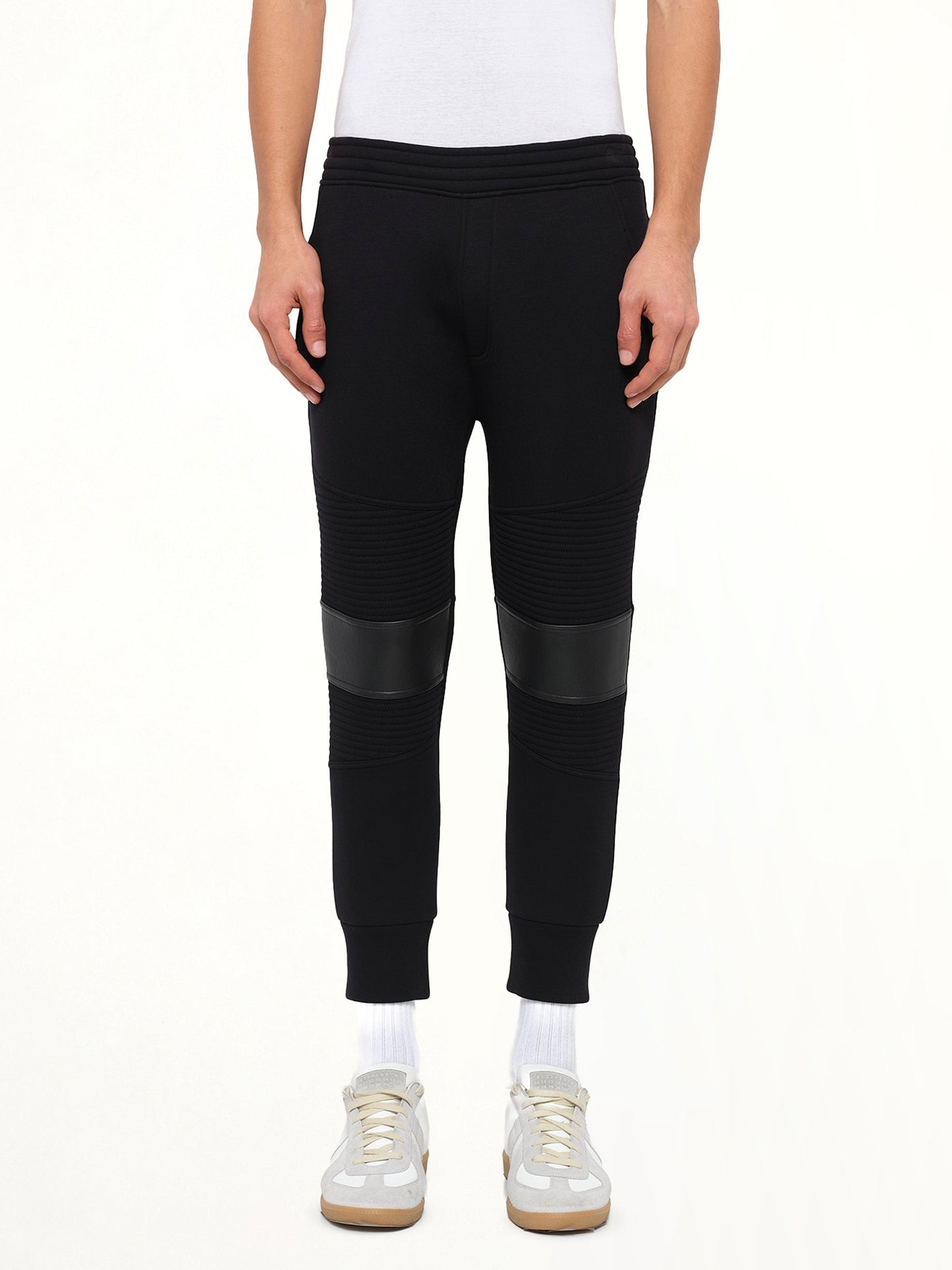 Image of a model wearing Pants. Product name - Neil Barrett Knit Pants in Black colour by brand - NEIL BARRETT
