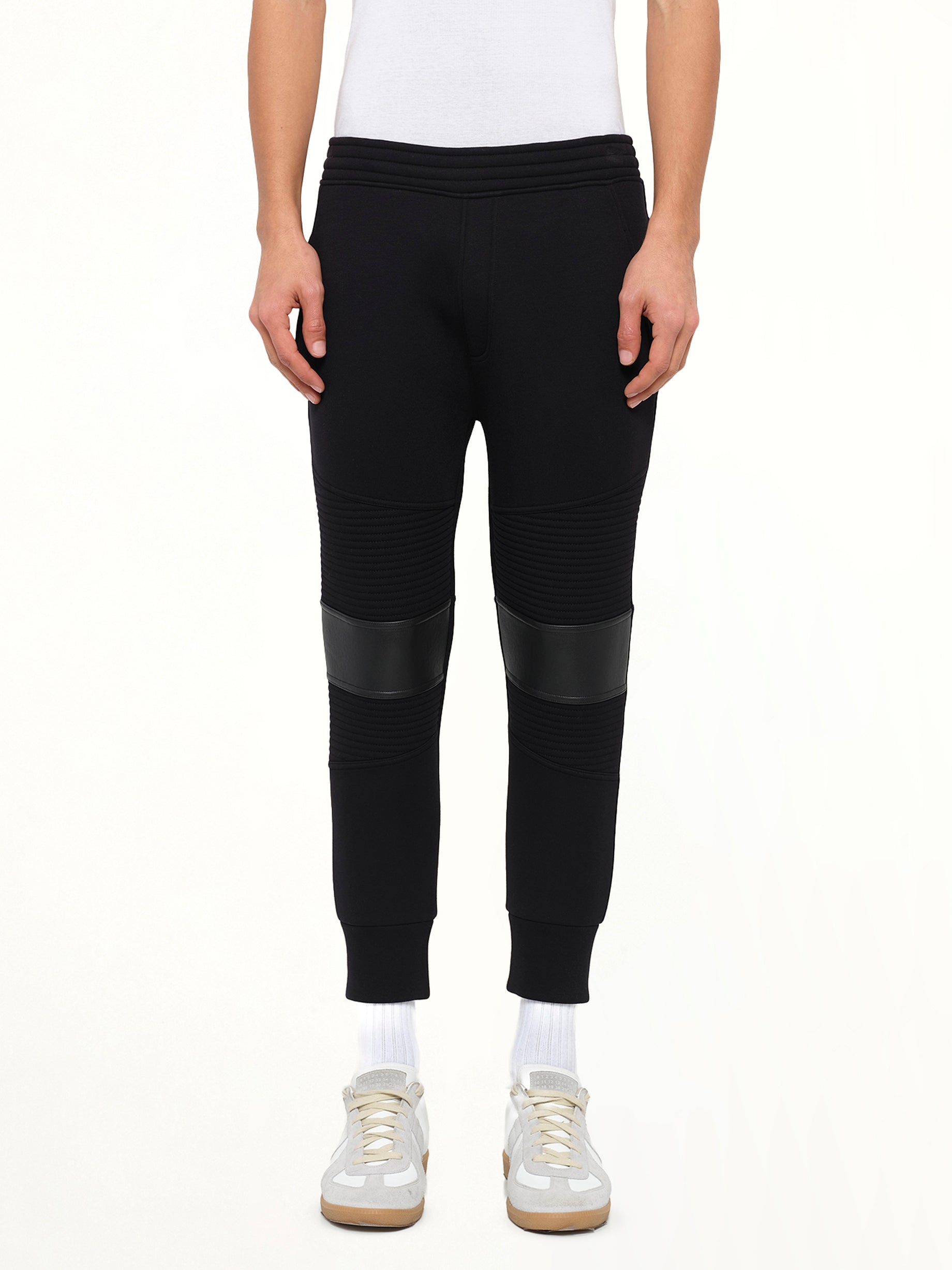 Image of a model wearing Pants. Product name - Neil Barrett Knit Pants in Black colour by brand - NEIL BARRETT