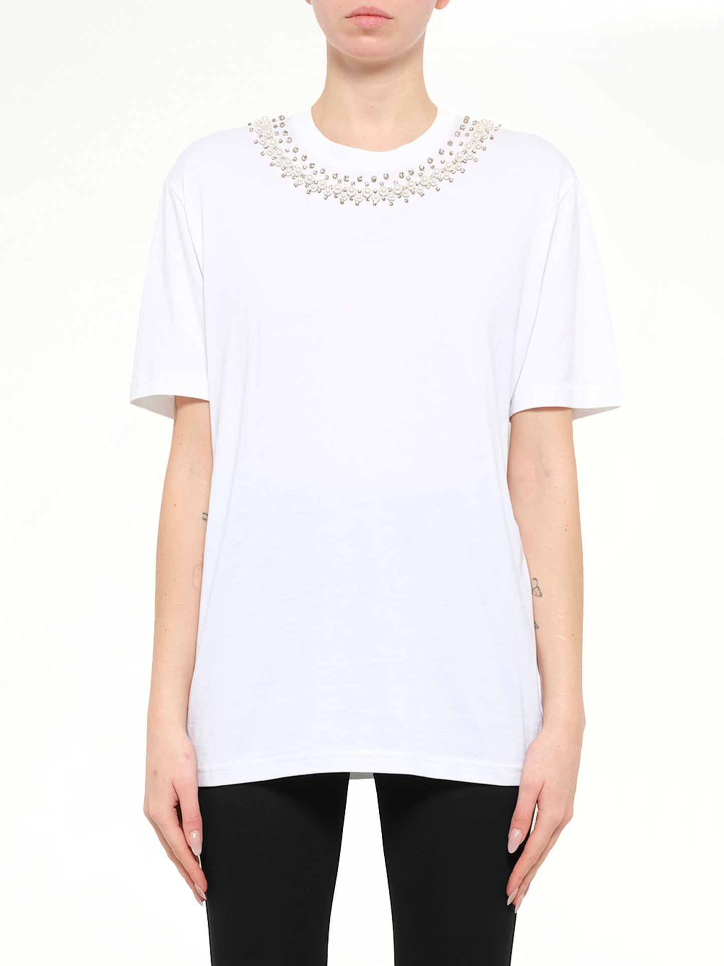 Image of a model wearing Tops. Product name - Short Sleeve T-Shirt in White colour by brand - GIVENCHY