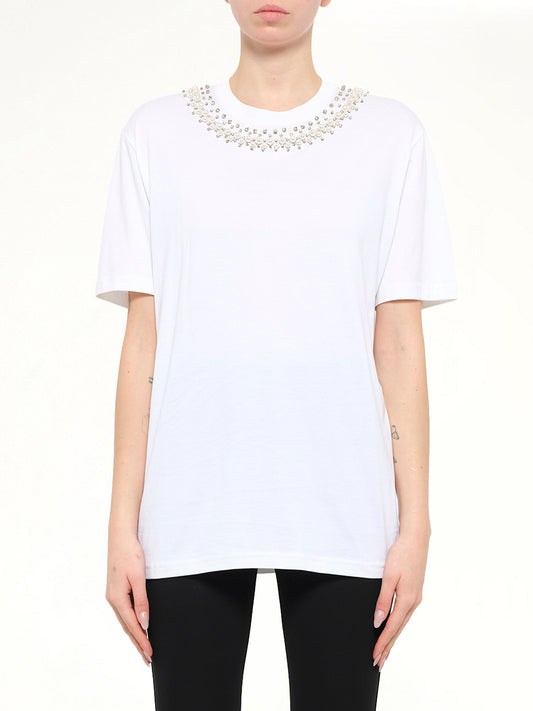 Image of a model wearing Tops. Product name - Short Sleeve T-Shirt in White colour by brand - GIVENCHY