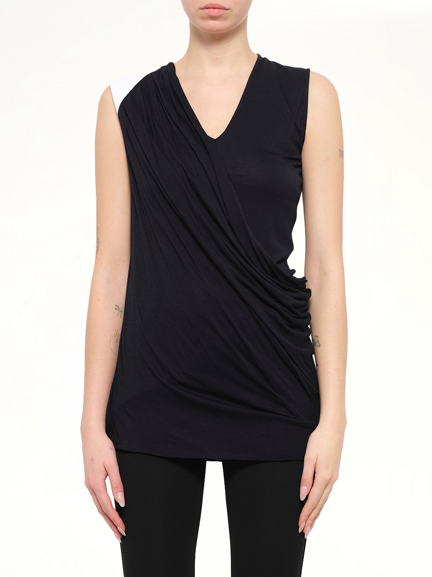 Image of a model wearing Tops. Product name - Sleeveless Top in Black colour by brand - GIVENCHY