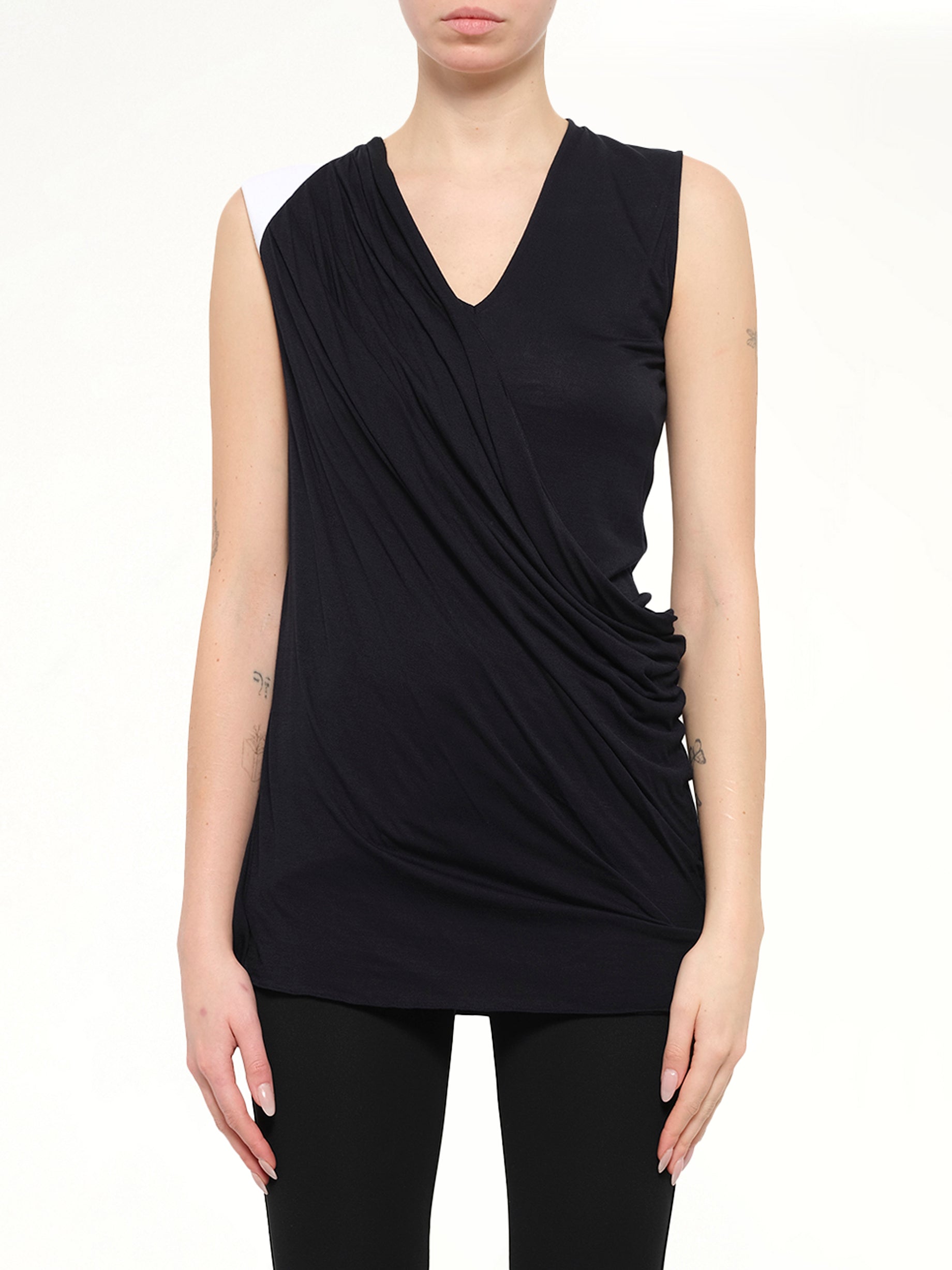 Image of a model wearing Tops. Product name - Sleeveless Top in Black colour by brand - GIVENCHY