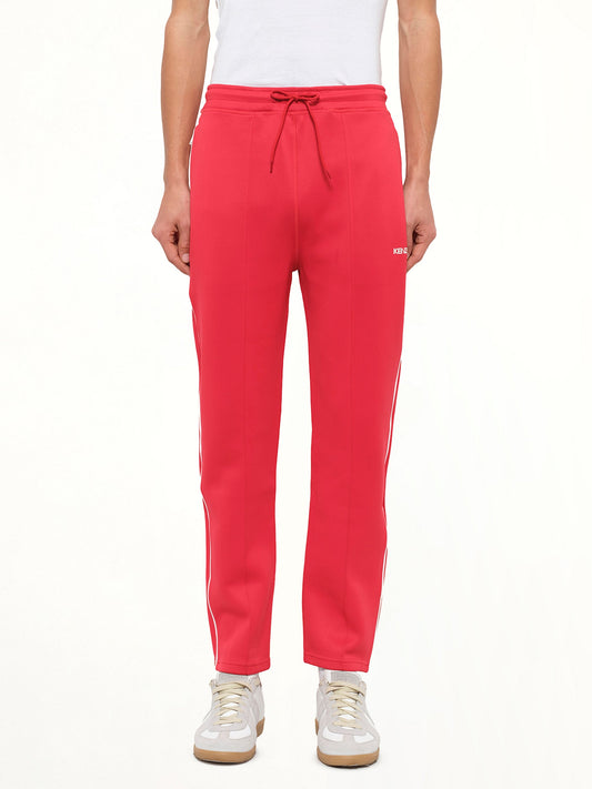 Image of a model wearing Pants. Product name - Casual Pants in Red colour by brand - KENZO
