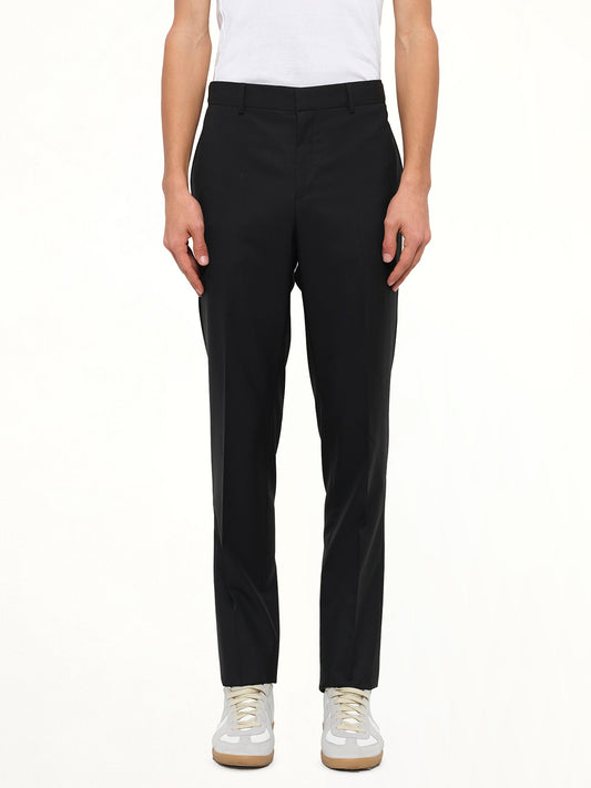 Image of a model wearing Pants. Product name - Classic Pants in Black colour by brand - GIVENCHY