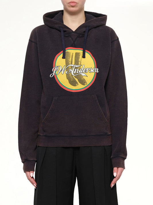 Image of a model wearing Outerwear. Product name - Cola Boots Hoodie in Ebony colour by brand - JWA