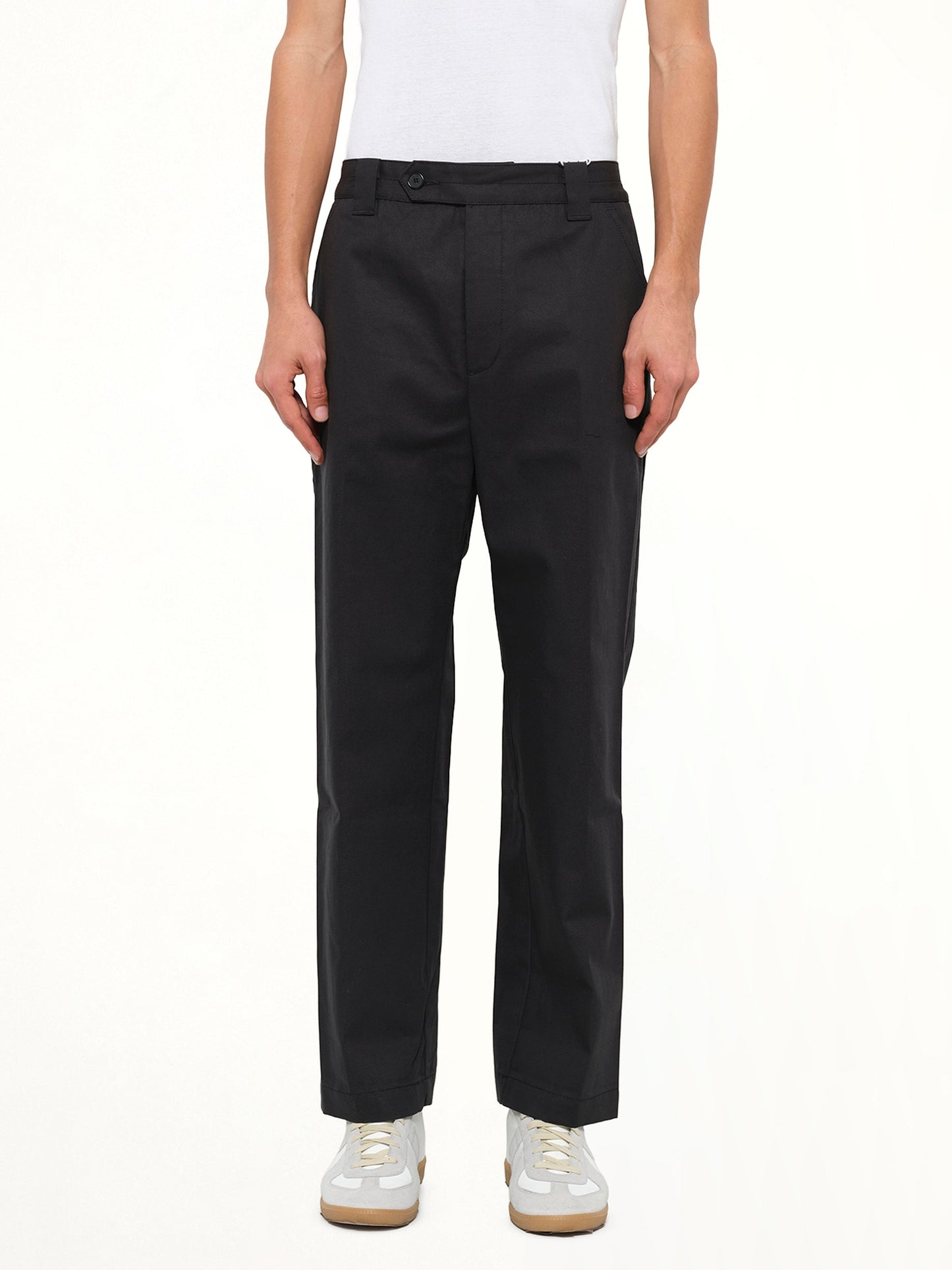 Image of a model wearing Pants. Product name - Cropped Pants in Black colour by brand - KENZO