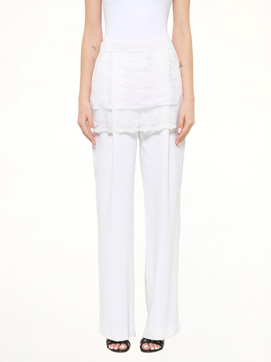 Image of a model wearing Pants. Product name - Givenchy Trousers in White colour by brand - GIVENCHY