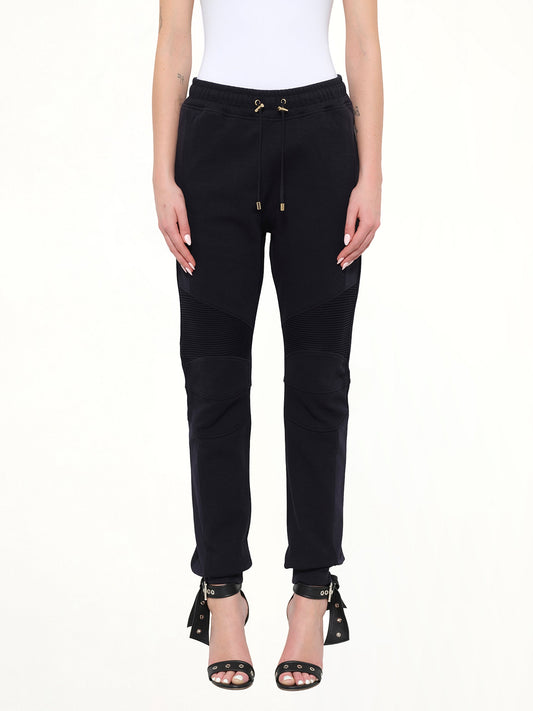 Image of a model wearing Pants. Product name - Jersey Biker Pants in 159 colour by brand - BALMAIN