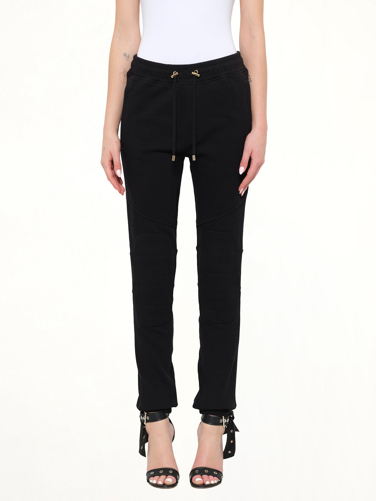 Image of a model wearing Pants. Product name - Jersey Piping Pants in 176 colour by brand - BALMAIN