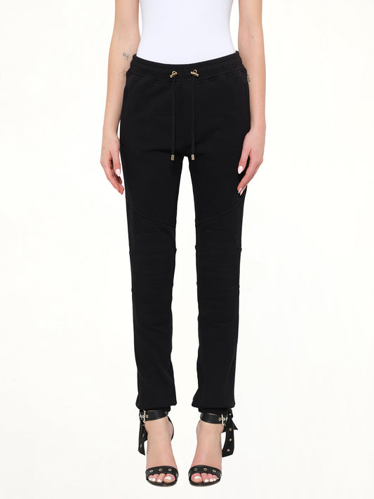 Image of a model wearing Pants. Product name - Jersey Piping Pants in 176 colour by brand - BALMAIN