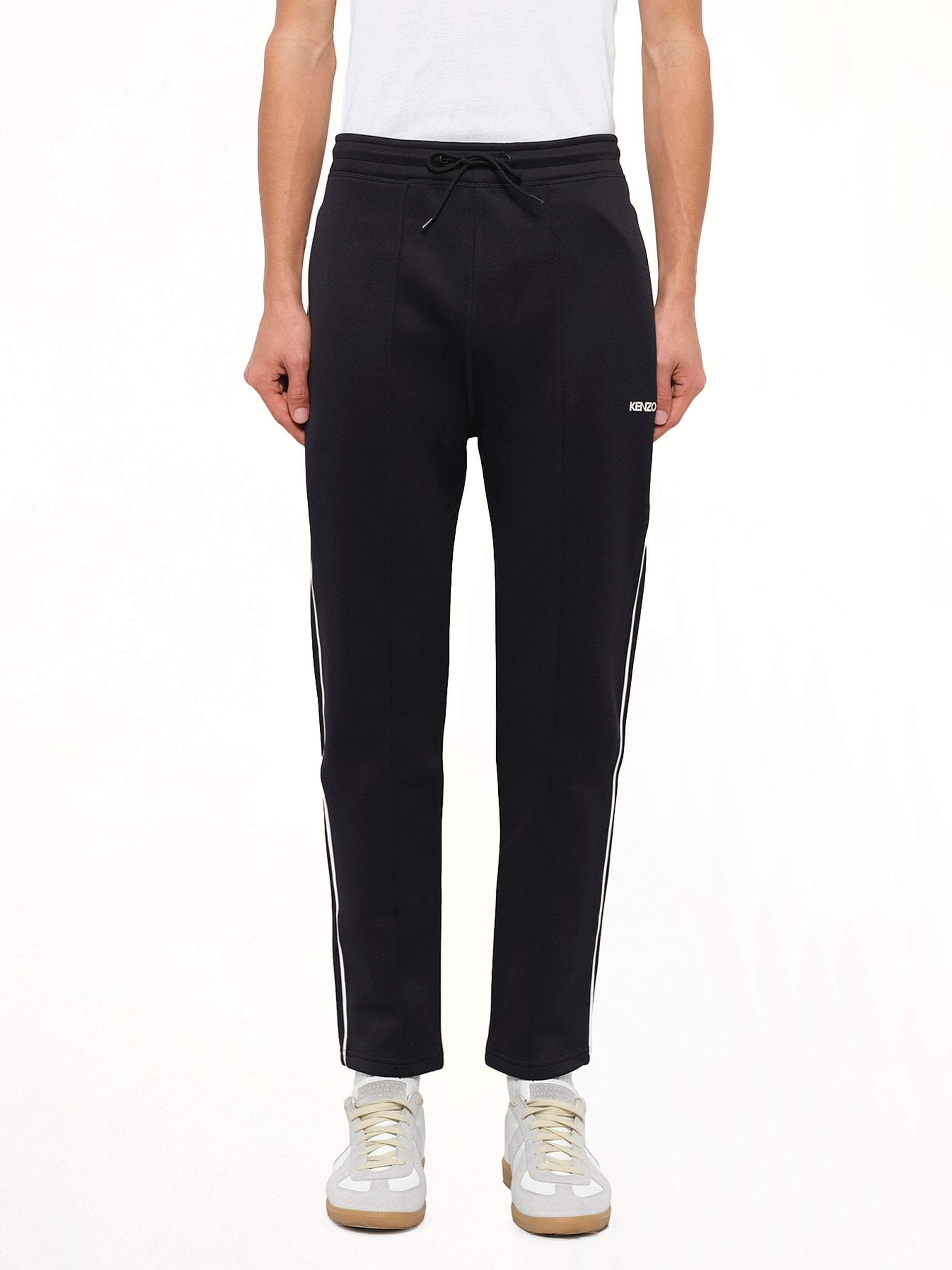 Image of a model wearing Pants. Product name - Kenzo Casual Pants in Black colour by brand - KENZO