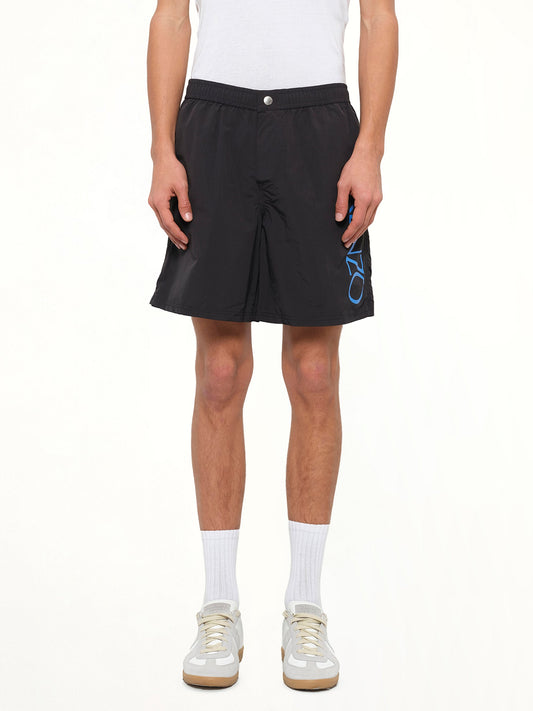 Image of a model wearing Shorts. Product name - Medium Logo Short in Black colour by brand - KENZO