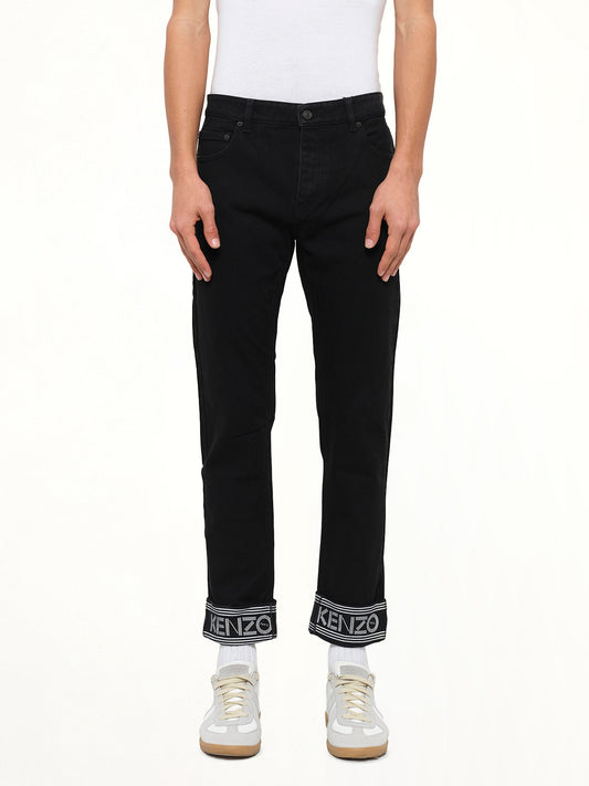 Image of a model wearing Pants. Product name - Slim Fit Kenzo in Black colour by brand - KENZO