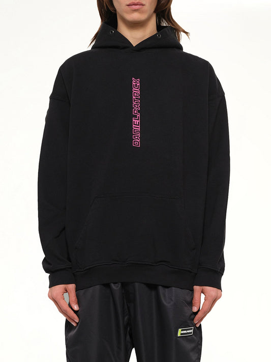 Image of a model wearing Outerwear. Product name - Vertical Logo Hoodie in Black colour by brand - DANIEL PATRICK