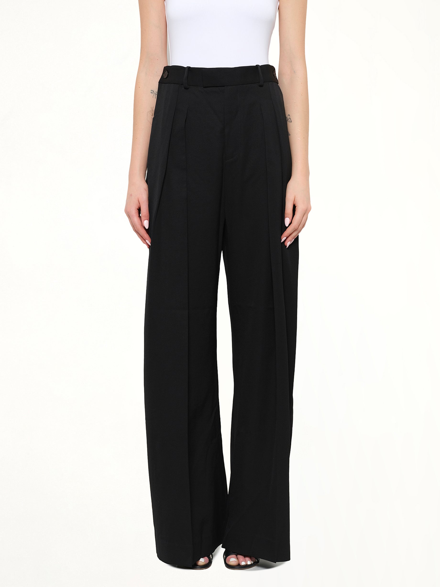 Image of a model wearing Pants. Product name - Wide Leg Trousers in Black colour by brand - JWA