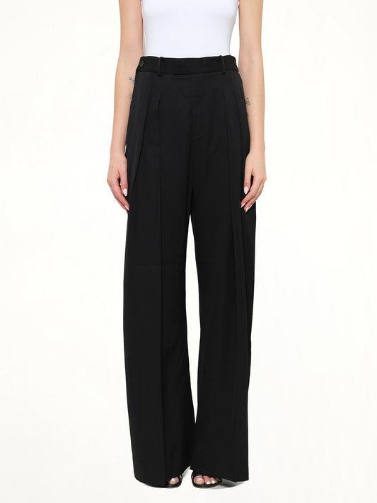 Image of a model wearing Pants. Product name - Wide Leg Trousers in Black colour by brand - JWA