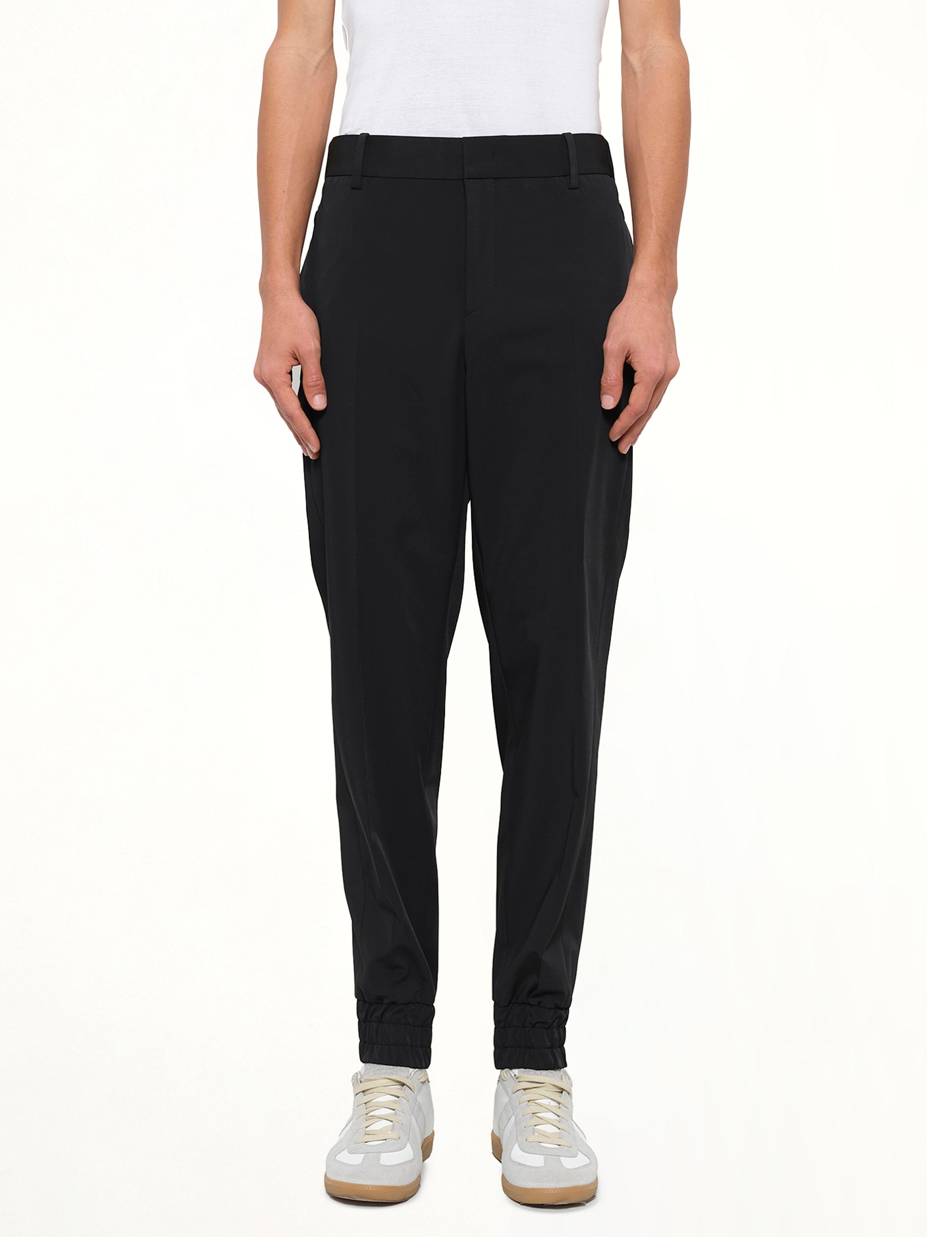 Image of a model wearing Pants. Product name - Wooyoungmi Casual Pant in Black colour by brand - WOOYOUNGMI