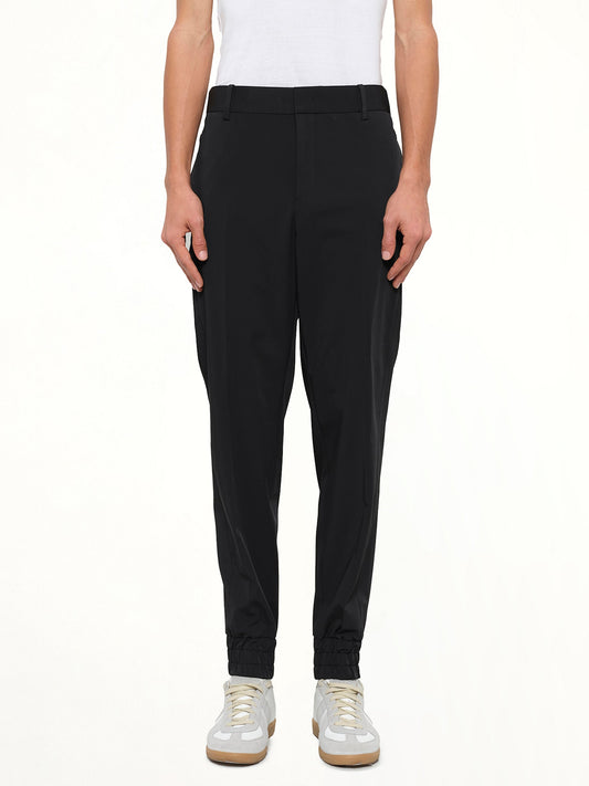 Image of a model wearing Pants. Product name - Wooyoungmi Casual Pant in Black colour by brand - WOOYOUNGMI