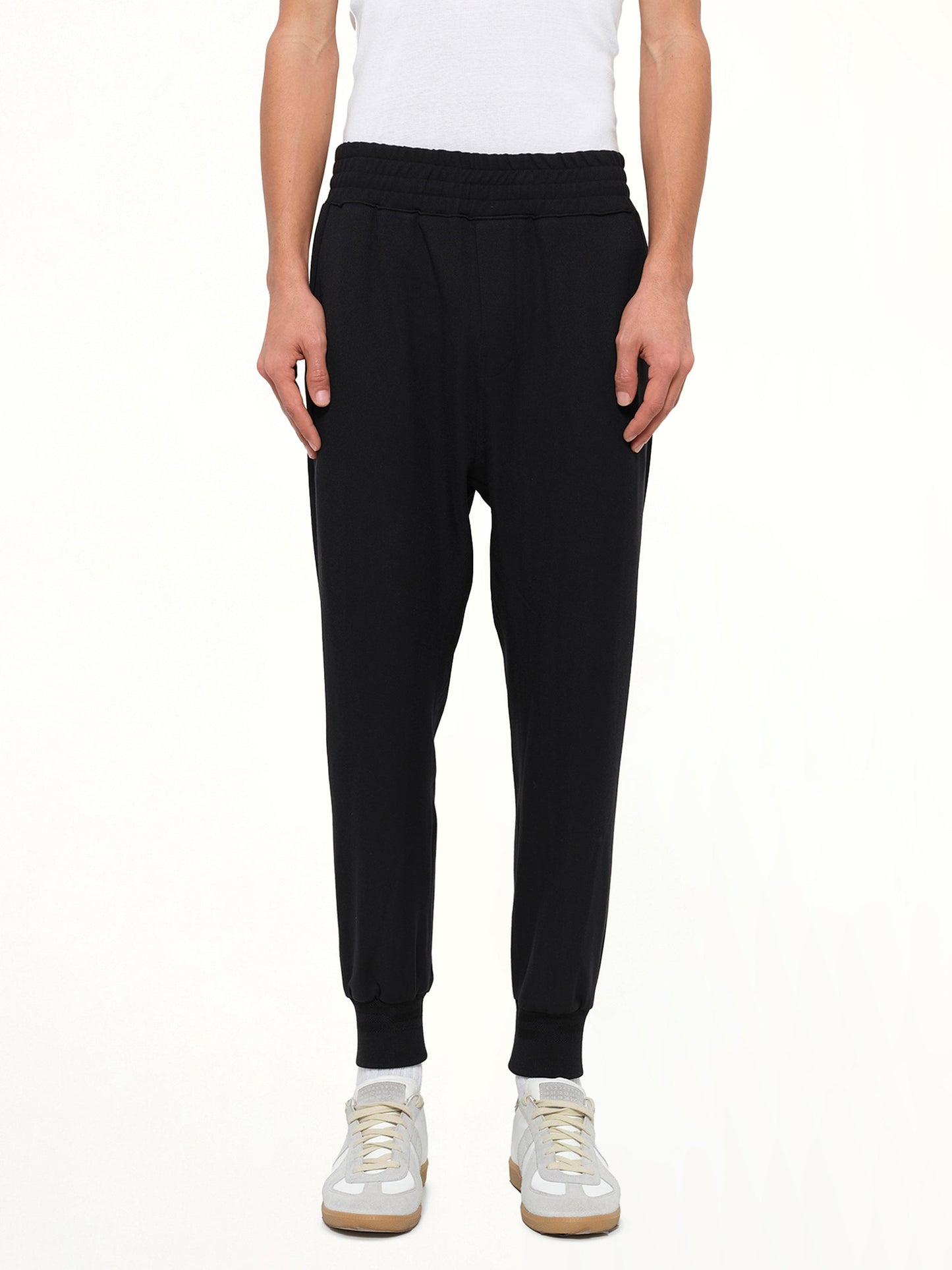 Image of a model wearing Pants. Product name - Woven Pants in Mix colour by brand - WOOYOUNGMI