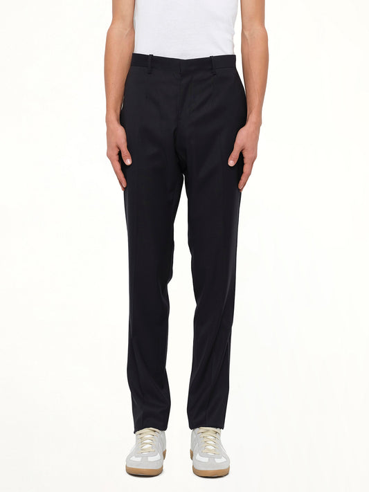 Image of a model wearing Pants. Product name - Wooyoungmi Woven Pants in Navy colour by brand - WOOYOUNGMI