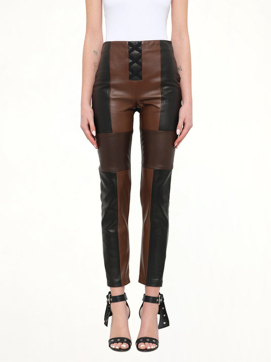 Image of a model wearing Pants. Product name - Neil Barrett Leather Pants in Black colour by brand - NEIL BARRETT
