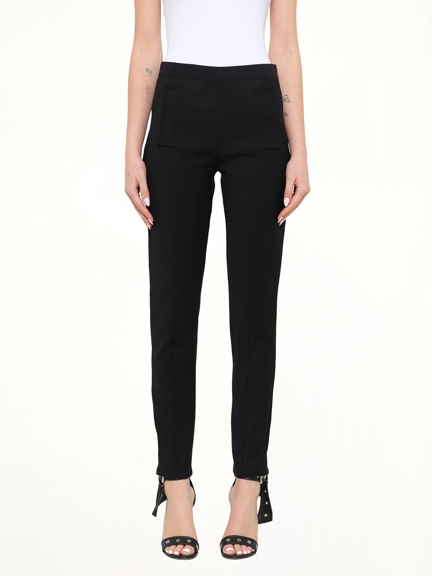 Image of a model wearing Pants. Product name - Neil Barrett Pants in Black colour by brand - NEIL BARRETT