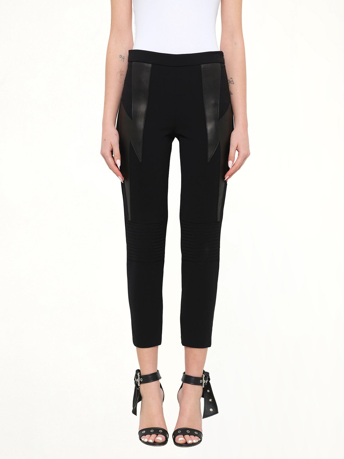 Image of a model wearing Pants. Product name - Neil Barrett Trousers in Black colour by brand - NEIL BARRETT