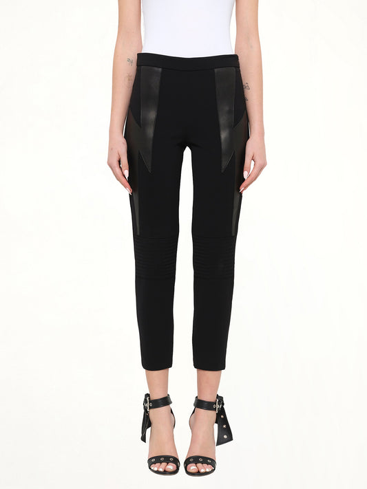 Image of a model wearing Pants. Product name - Neil Barrett Trousers in Black colour by brand - NEIL BARRETT