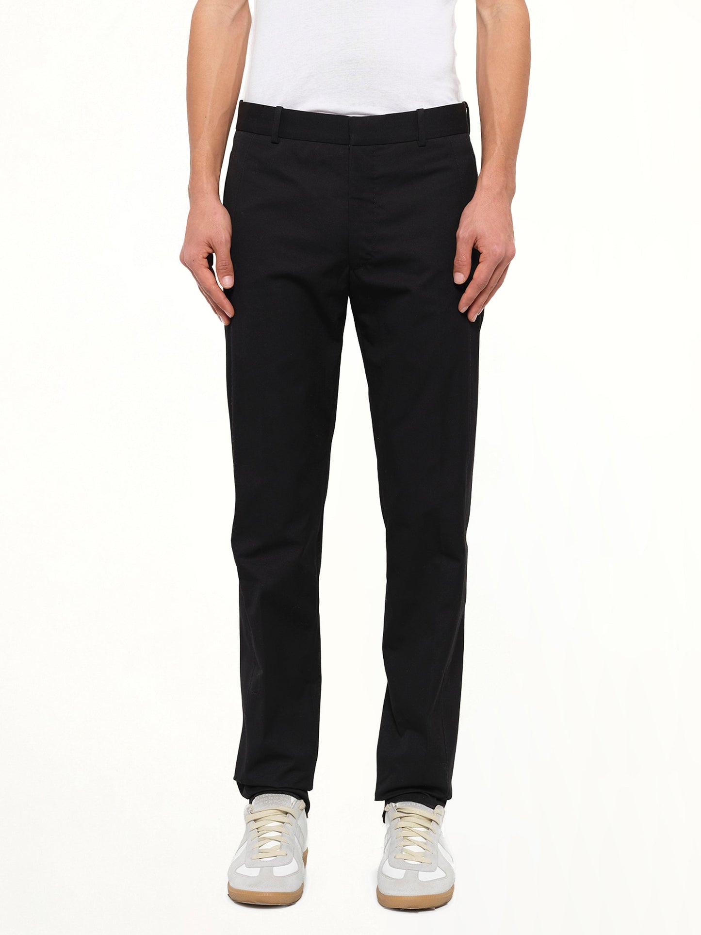 Image of a model wearing Pants. Product name - Alexander McQueen Trouser in Black colour by brand - ALEXANDER MCQUEEN