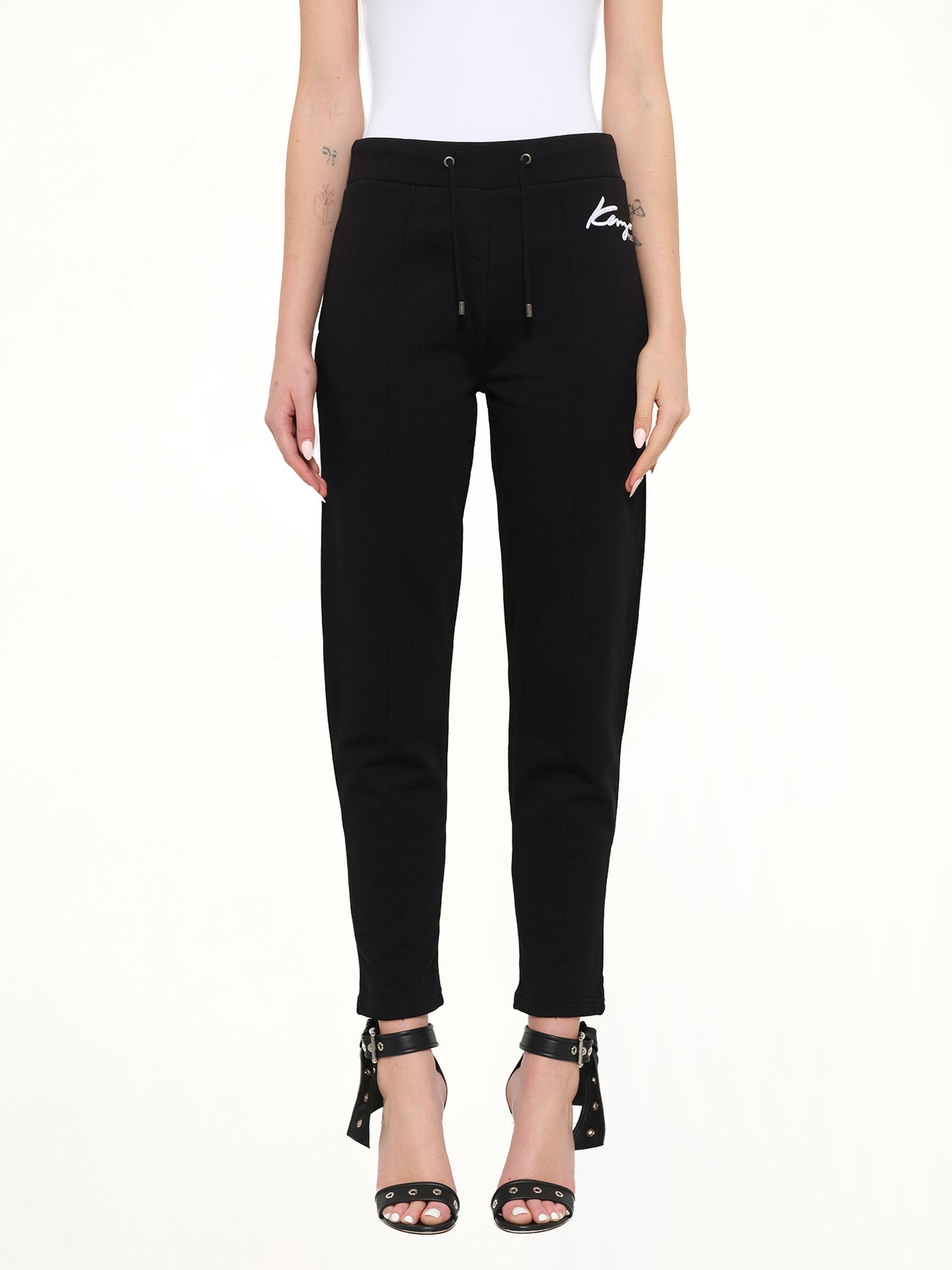 Image of a model wearing Pants. Product name - Fashion Pants in Black colour by brand - KENZO