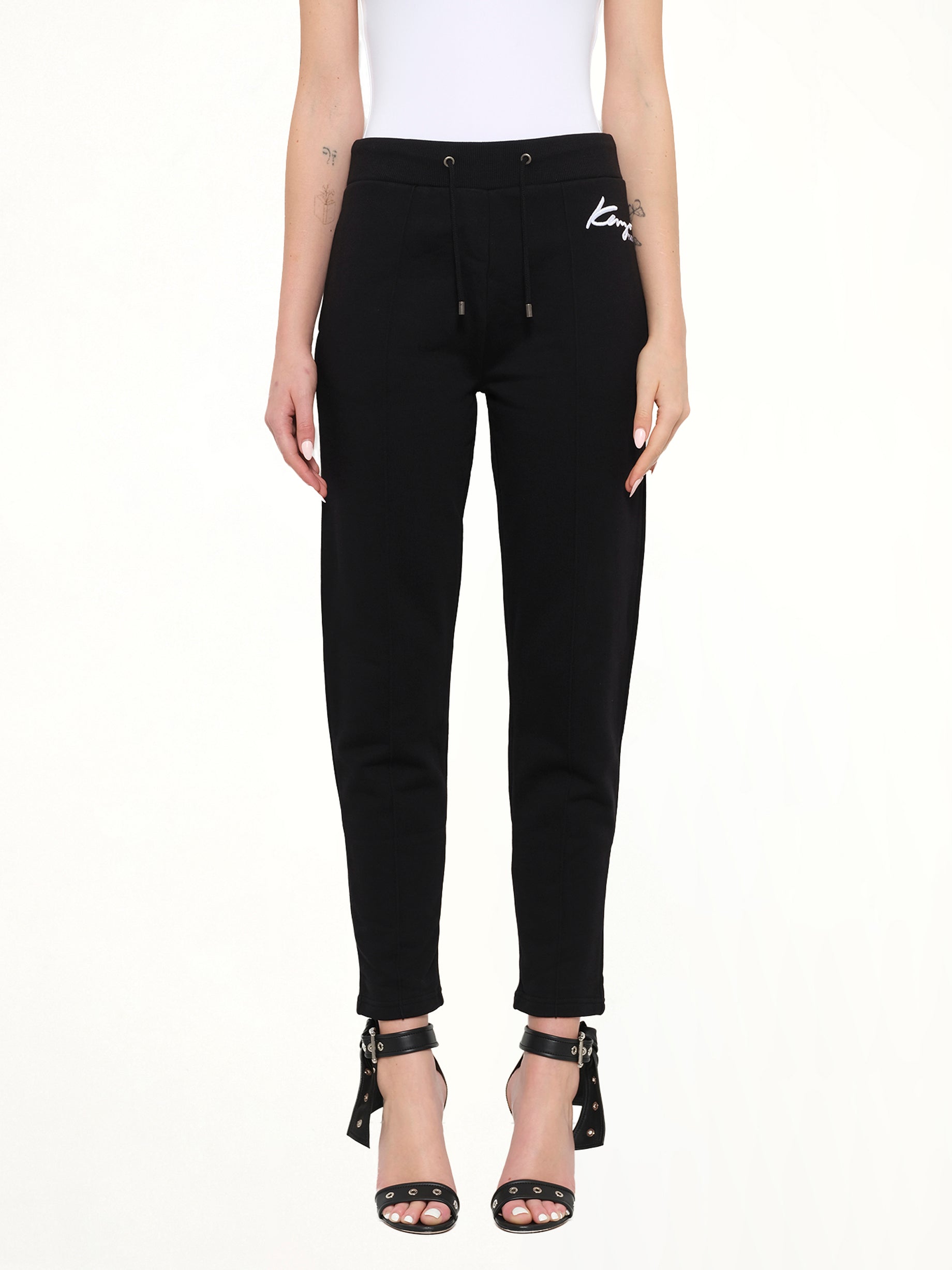 Image of a model wearing Pants. Product name - Fashion Pants in Black colour by brand - KENZO