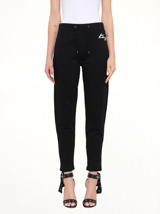 Image of a model wearing Pants. Product name - Fashion Pants in Black colour by brand - KENZO