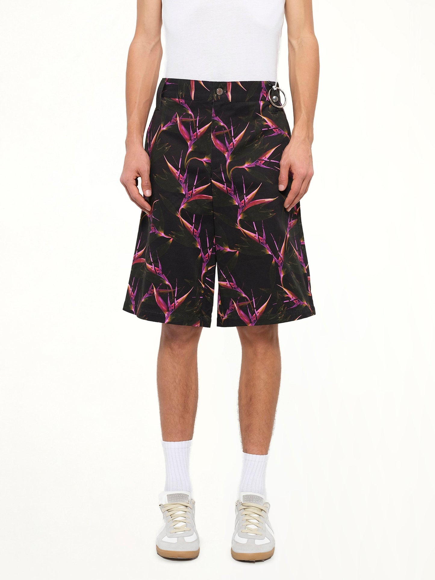 Image of a model wearing Shorts. Product name - Flower Shorts in Black colour by brand - GIVENCHY
