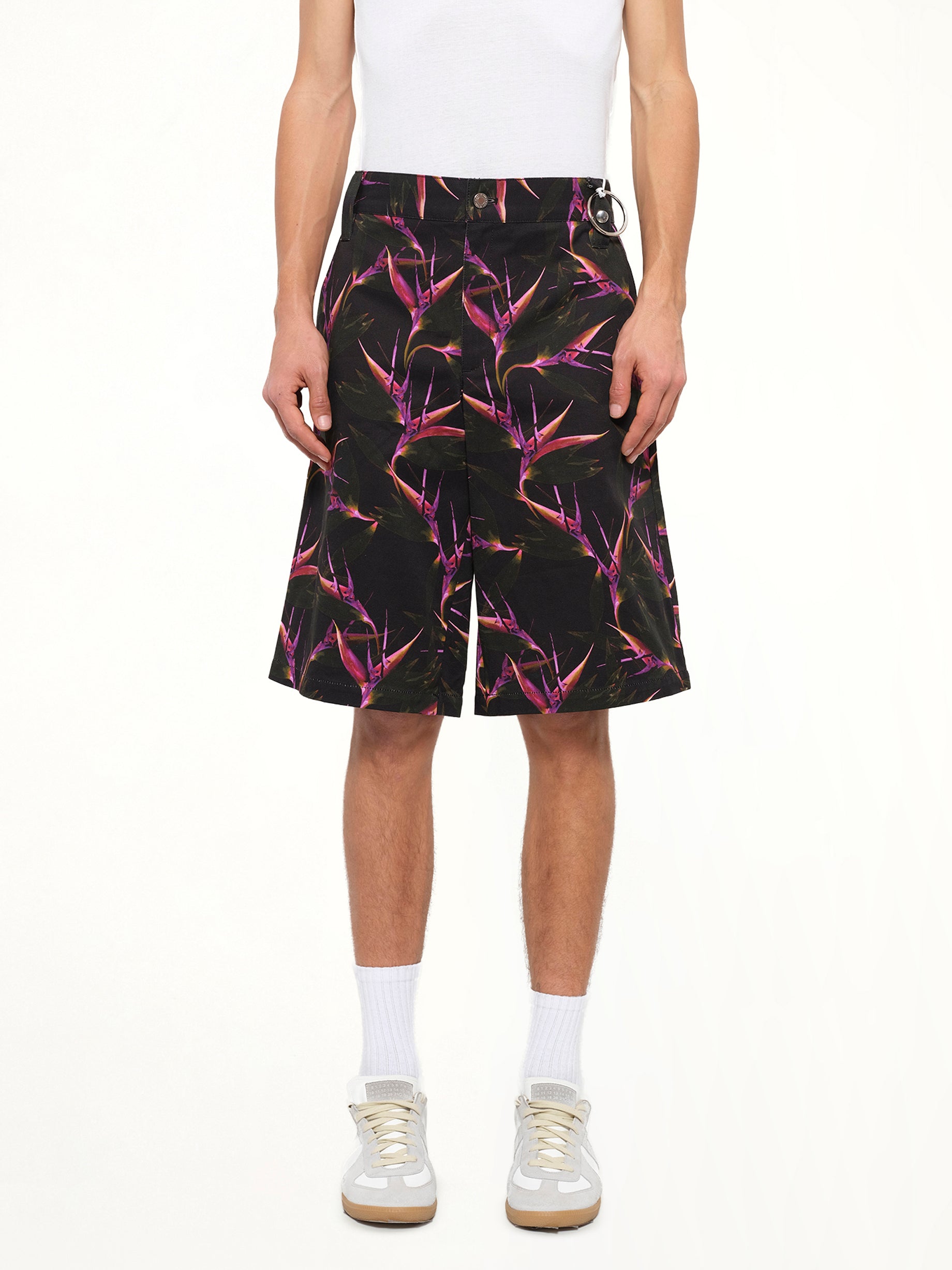 Image of a model wearing Shorts. Product name - Flower Shorts in Black colour by brand - GIVENCHY