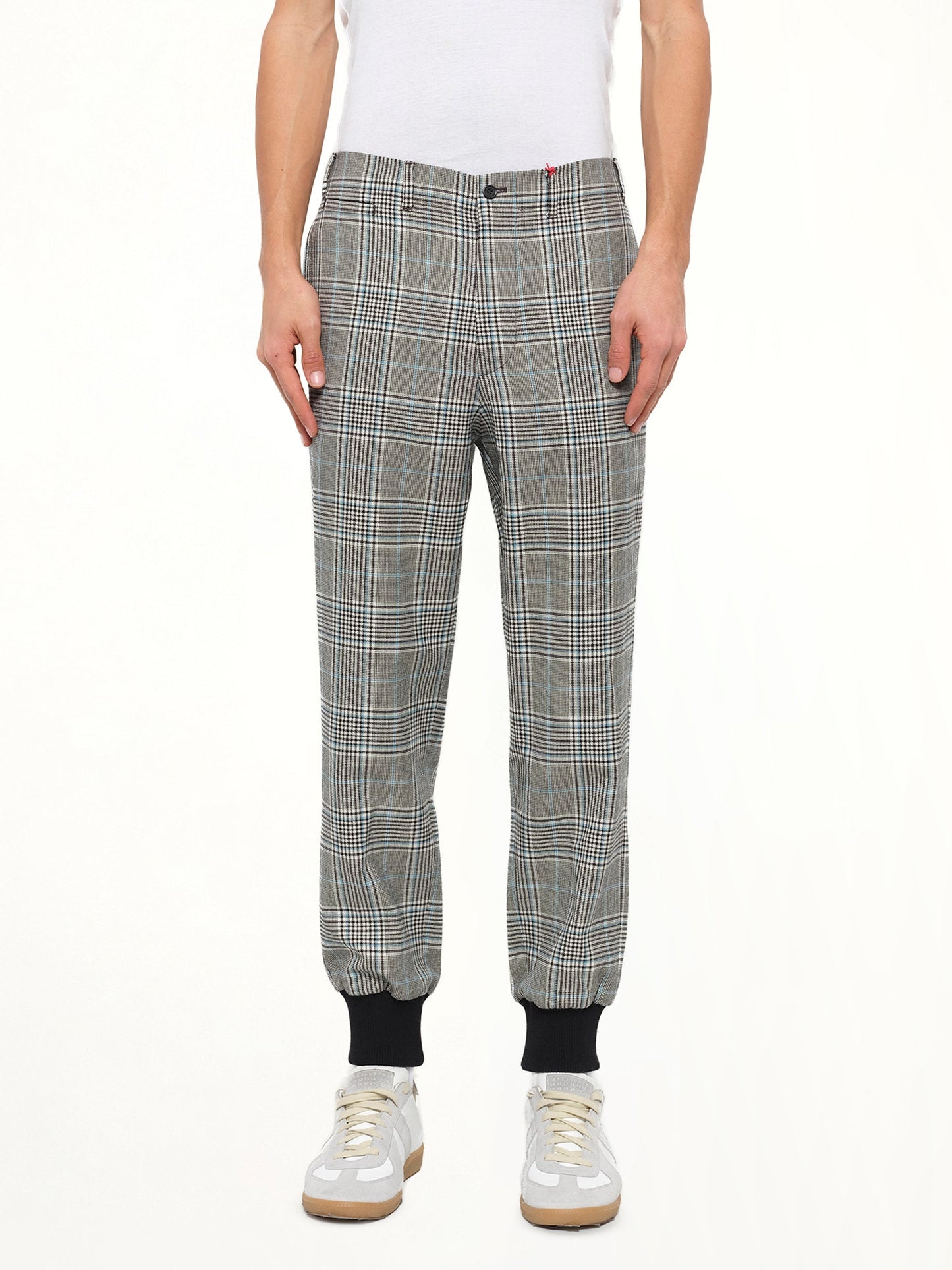 Image of a model wearing Pants. Product name - Jogger Pant in Ivo/Blk colour by brand - ALEXANDER MCQUEEN