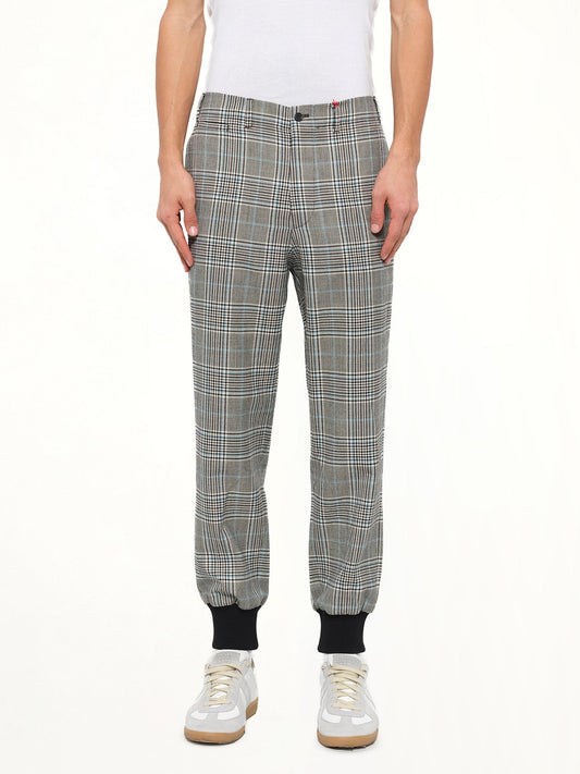 Image of a model wearing Pants. Product name - Jogger Pant in Ivo/Blk colour by brand - ALEXANDER MCQUEEN