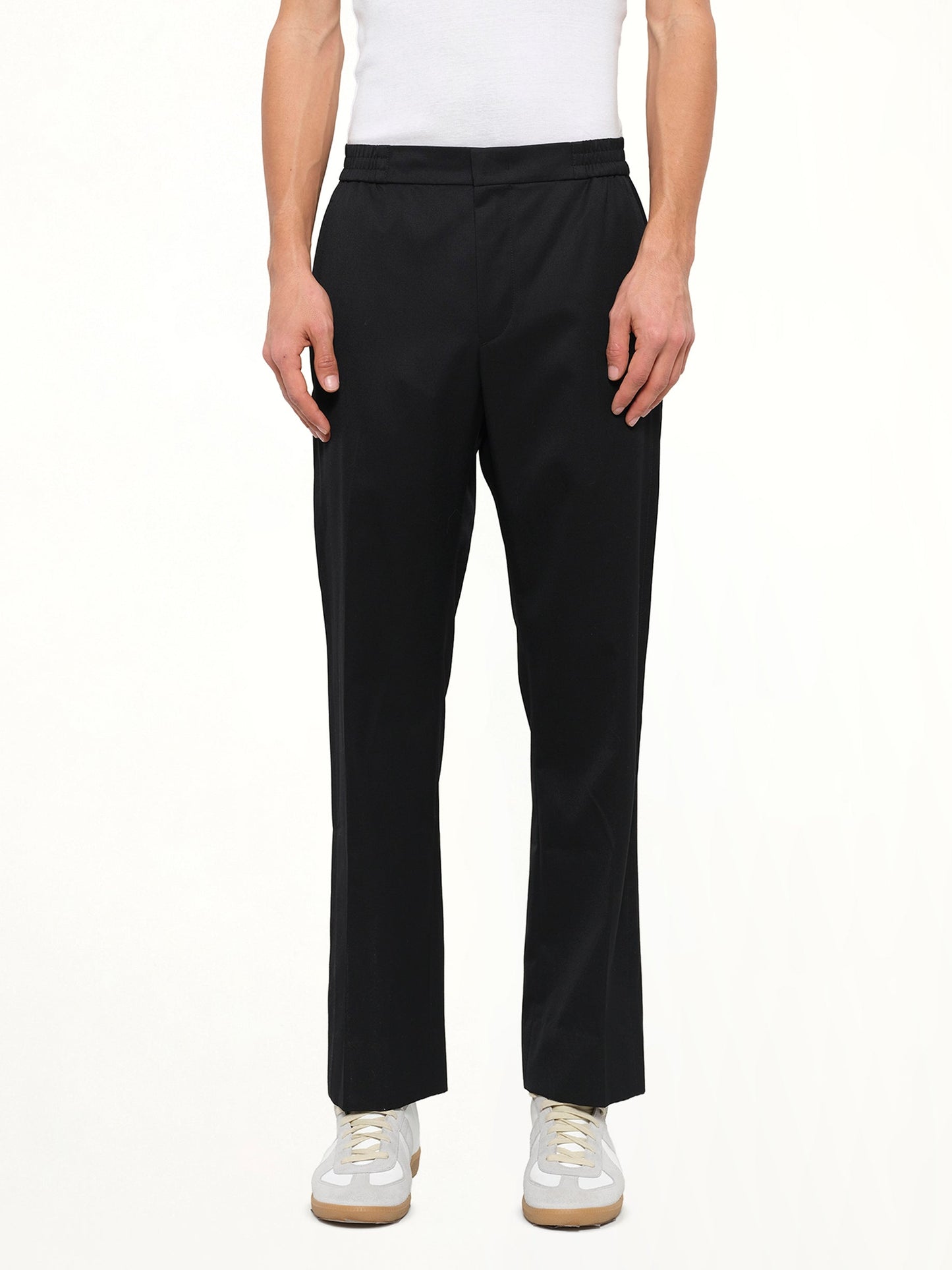 Image of a model wearing Pants. Product name - Juunj Trouser in Black colour by brand - JUUNJ