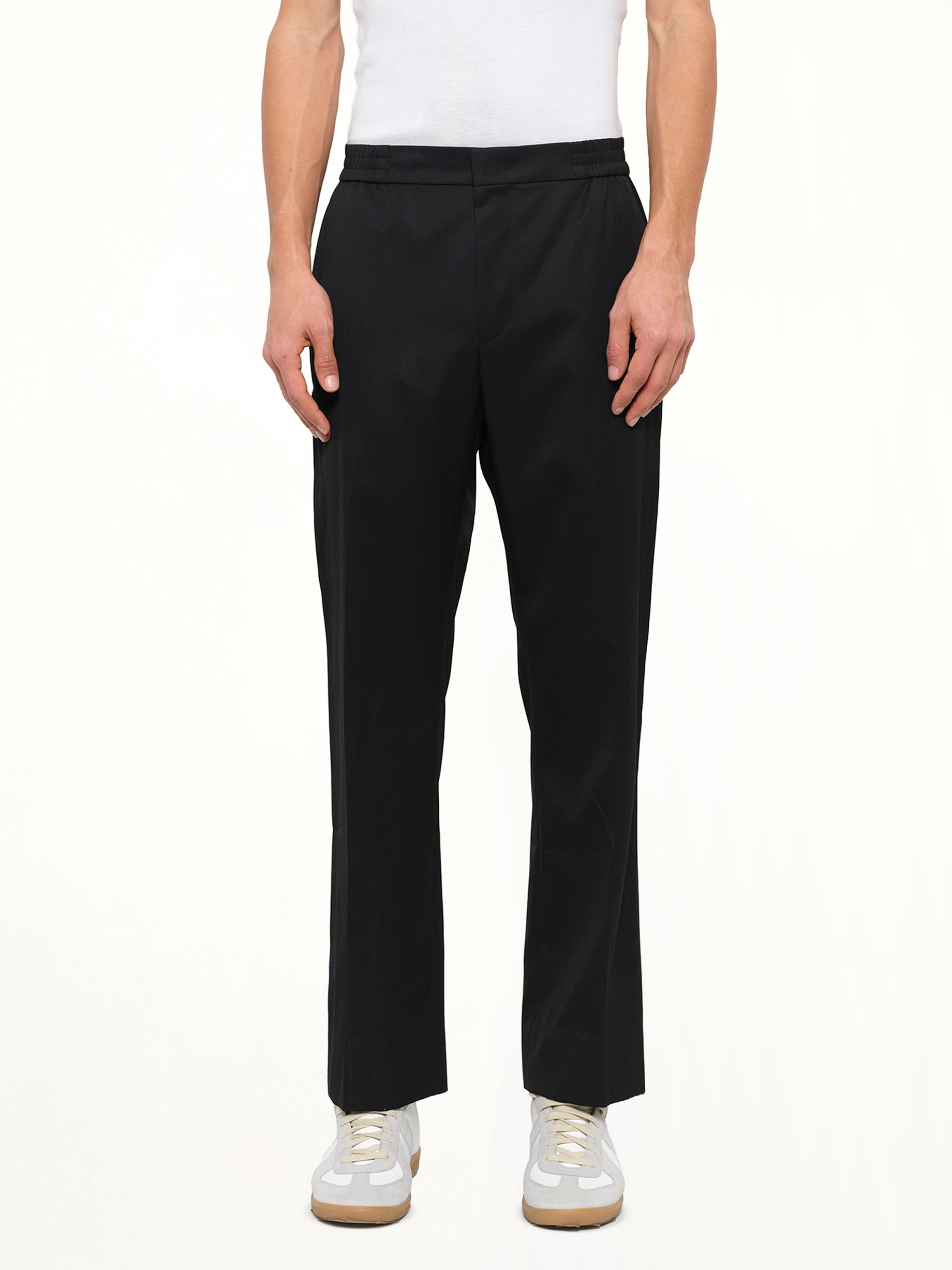 Image of a model wearing Pants. Product name - Juunj Trouser in Black colour by brand - JUUNJ