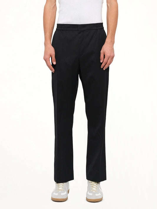 Image of a model wearing Pants. Product name - Juunj Trouser in Black colour by brand - JUUNJ