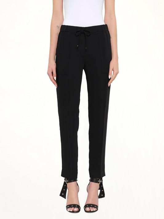 Image of a model wearing Pants. Product name - Kenzo Trousers in Black colour by brand - KENZO