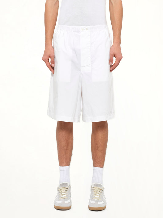 Image of a model wearing Shorts. Product name - Loewe Shorts in White colour by brand - LOEWE