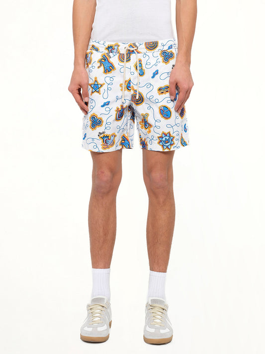 Image of a model wearing Shorts. Product name - Loewe x Paula Printed Swim Shorts in White colour by brand - LOEWE
