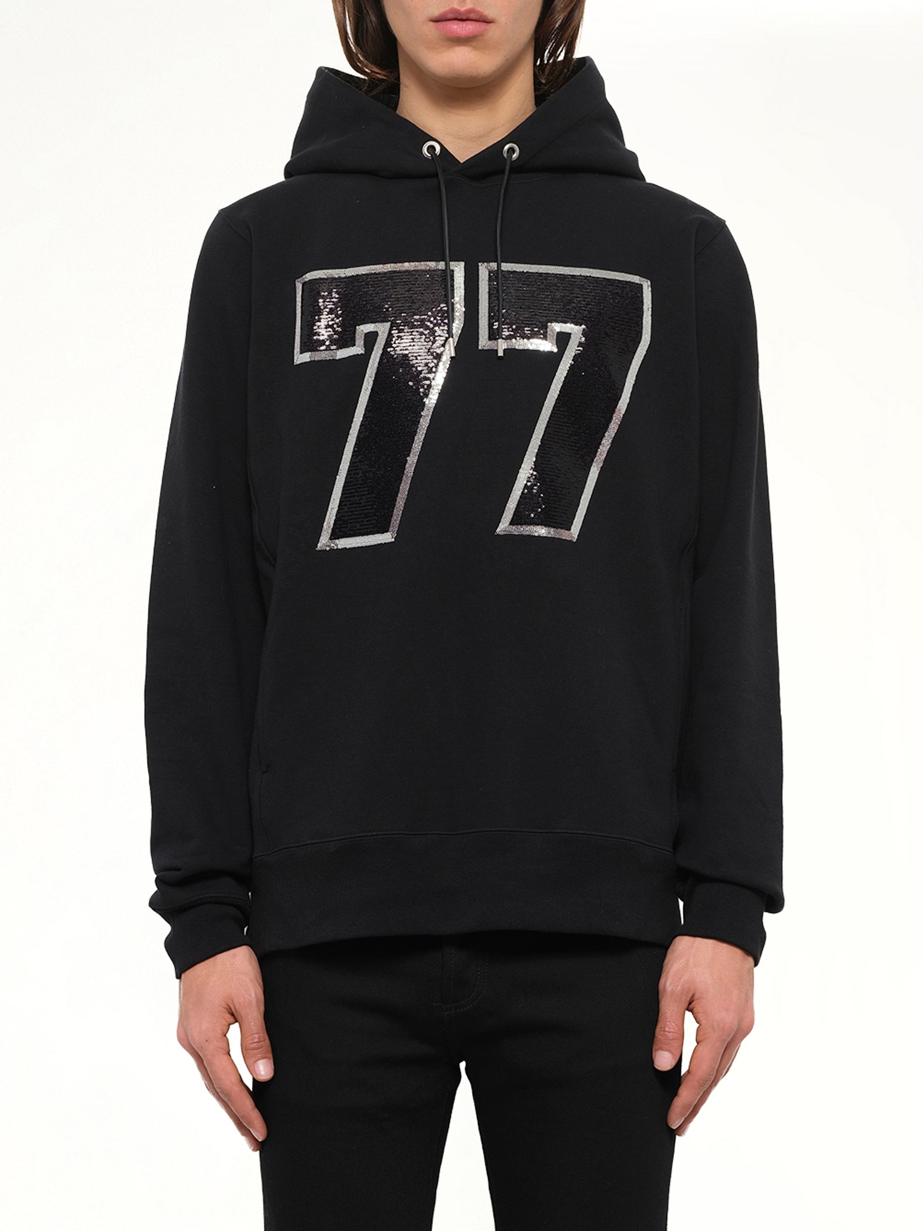 Image of a model wearing Outerwear. Product name - Mastermind Logo Sweatshirt in Black colour by brand - MASTERMIND