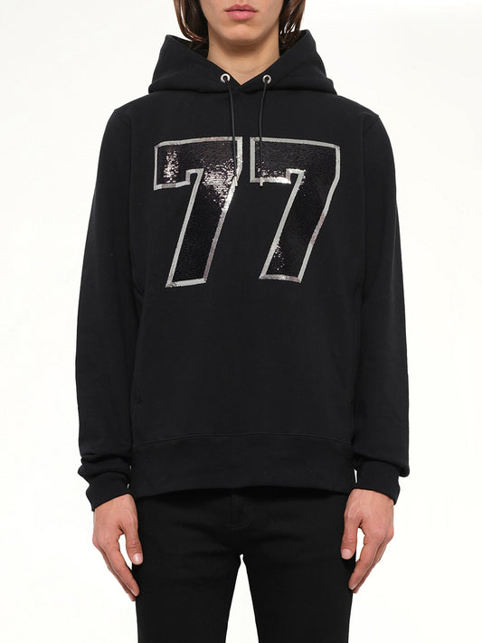 Image of a model wearing Outerwear. Product name - Mastermind Logo Sweatshirt in Black colour by brand - MASTERMIND
