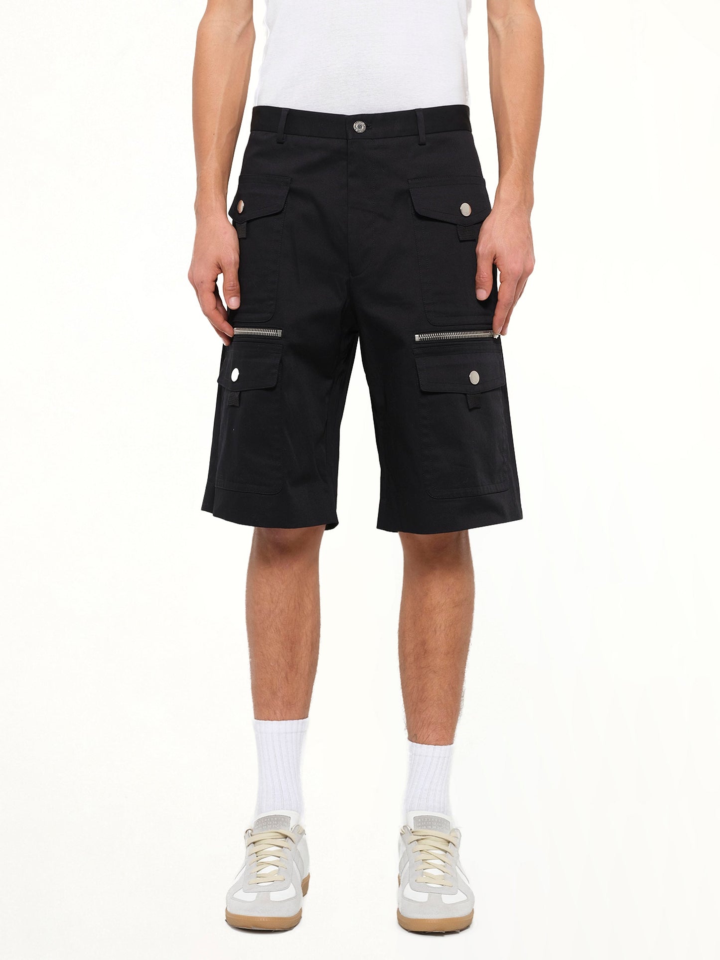 Image of a model wearing Shorts. Product name - Pockets Shorts in Black colour by brand - GIVENCHY