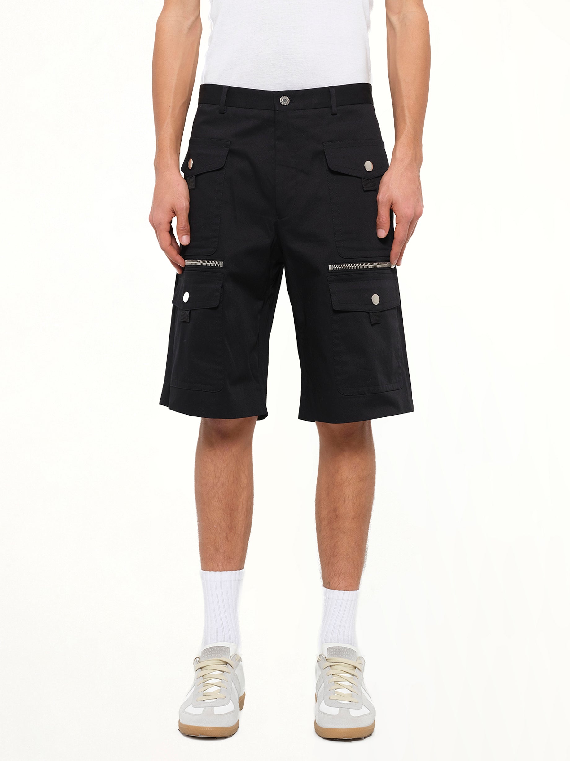 Image of a model wearing Shorts. Product name - Pockets Shorts in Black colour by brand - GIVENCHY