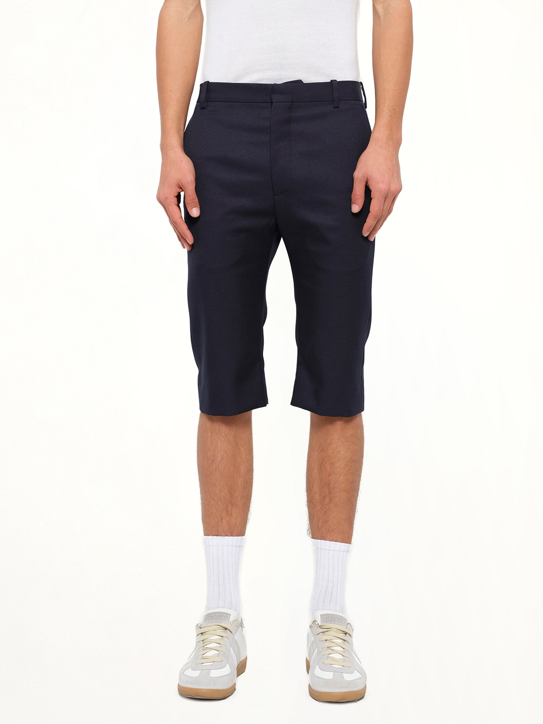 Image of a model wearing Shorts. Product name - Serge Shorts in 8065 colour by brand - BALENCIAGA