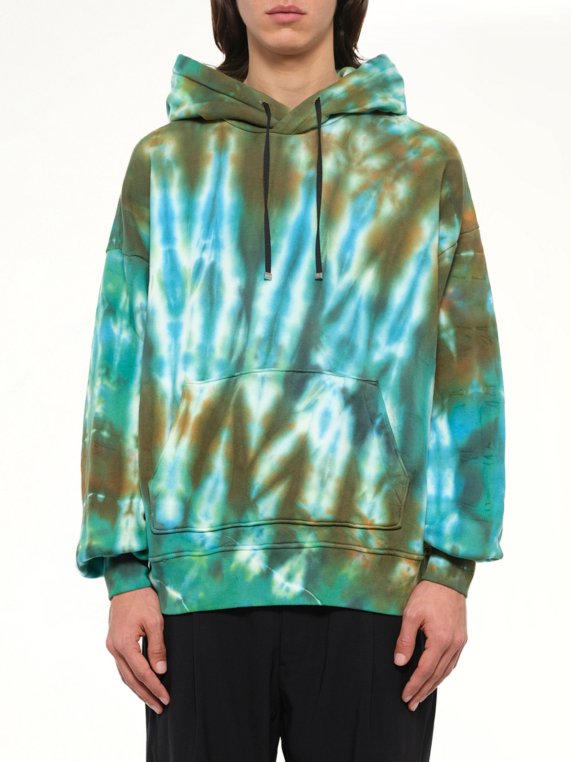 Image of a model wearing Outerwear. Product name - Tie Dye Oversize Hoodie in Green colour by brand - AMIRI