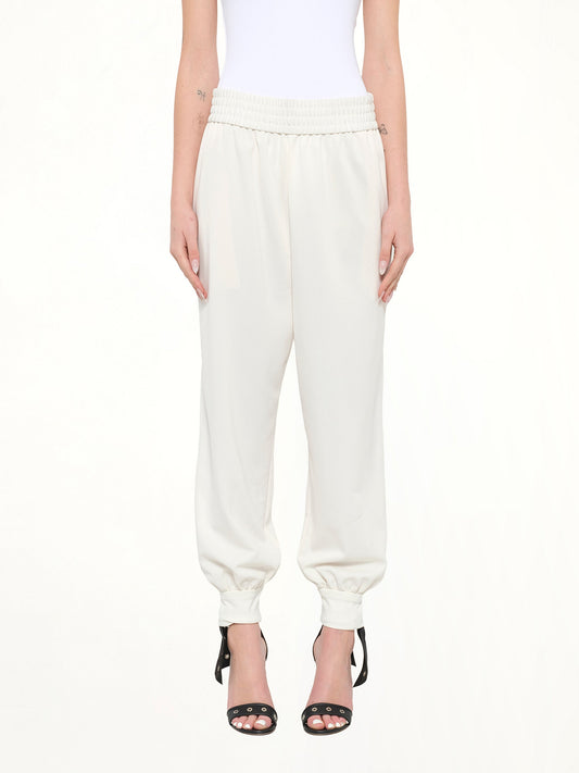 Image of a model wearing Pants. Product name - Jogger Pant in White colour by brand - MARC JACOBS